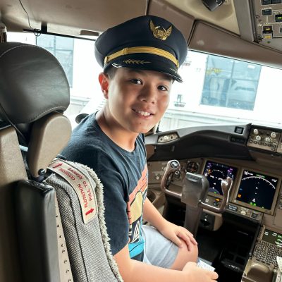 Noah in plane traveling to Cooperstown
